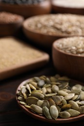 Photo of Different seeds and cereals on table, closeup