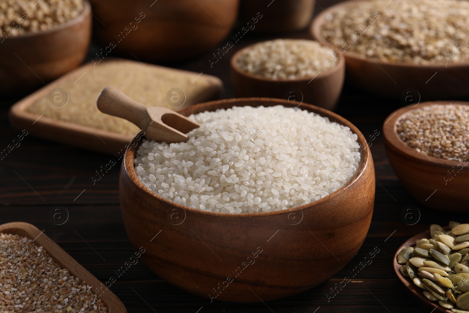 Photo of Different cereals and seeds on table, closeup