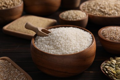 Photo of Different cereals and seeds on table, closeup