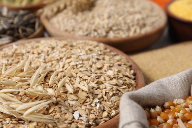 Photo of Different types of cereals on table, closeup