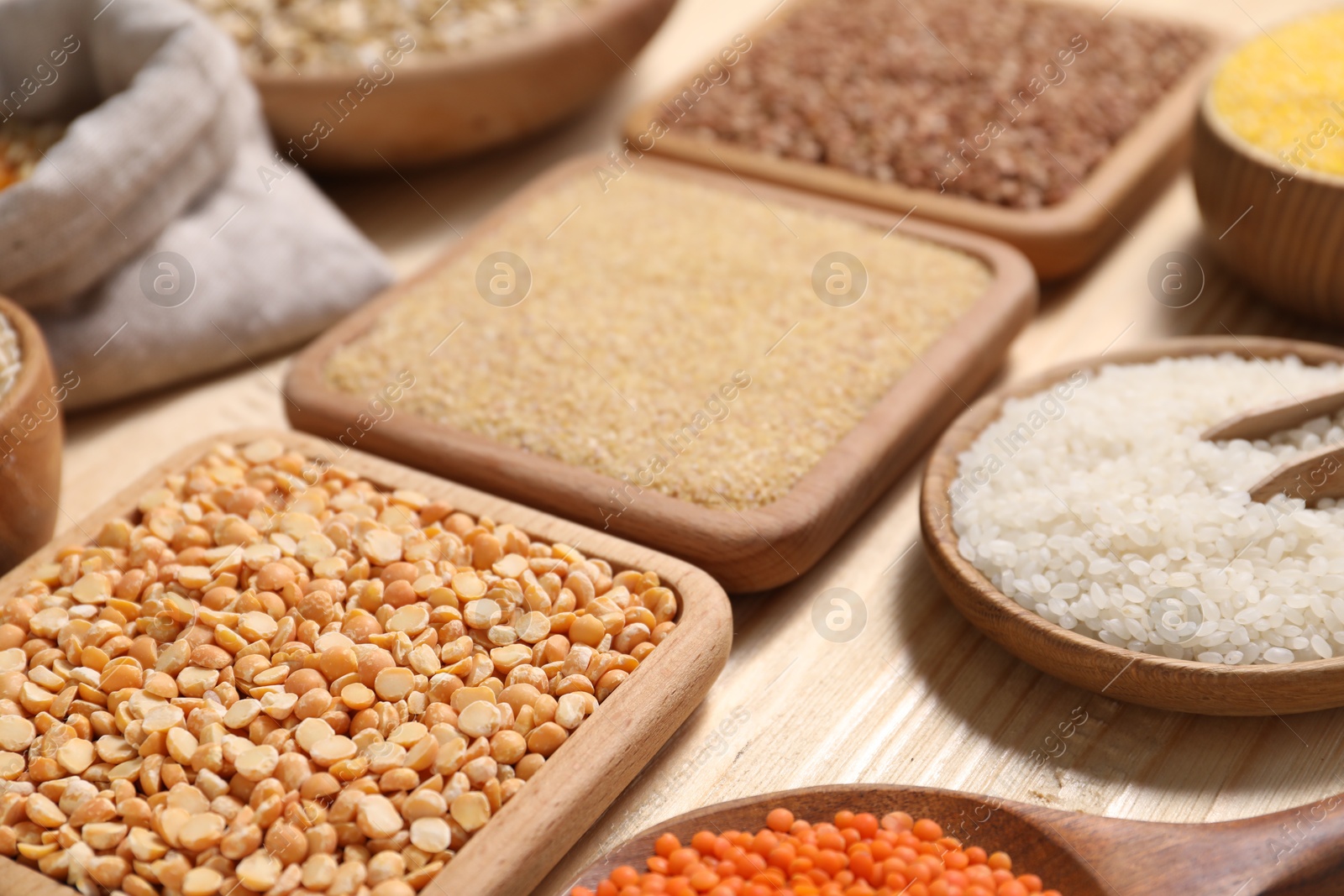 Photo of Different types of cereals and legumes on table, closeup