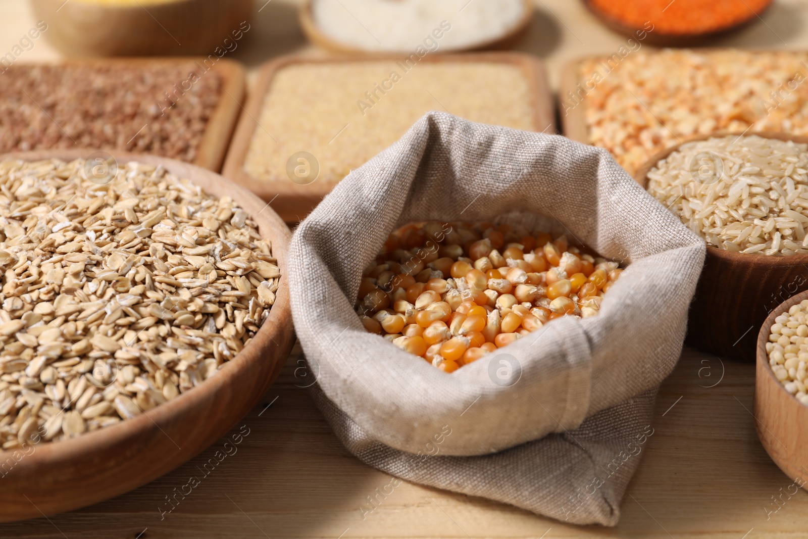 Photo of Different types of cereals on table, closeup