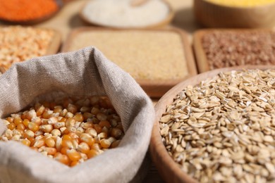 Photo of Different types of cereals on table, closeup