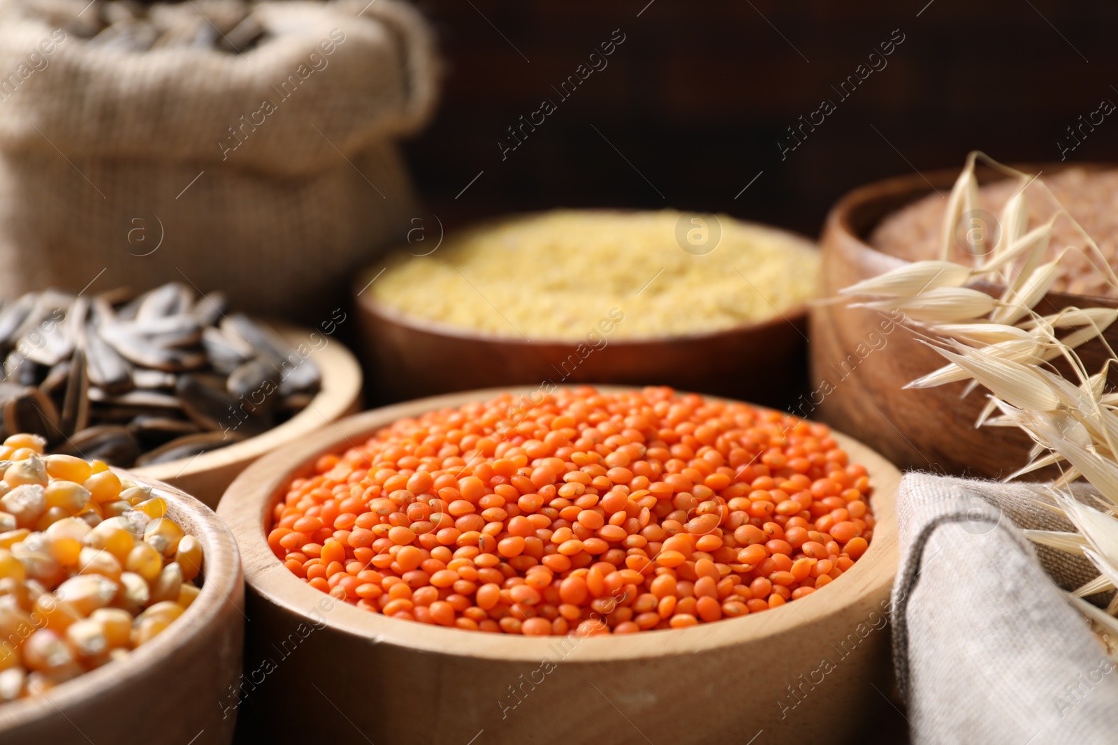 Photo of Different types of cereals, seeds and legumes on table, closeup