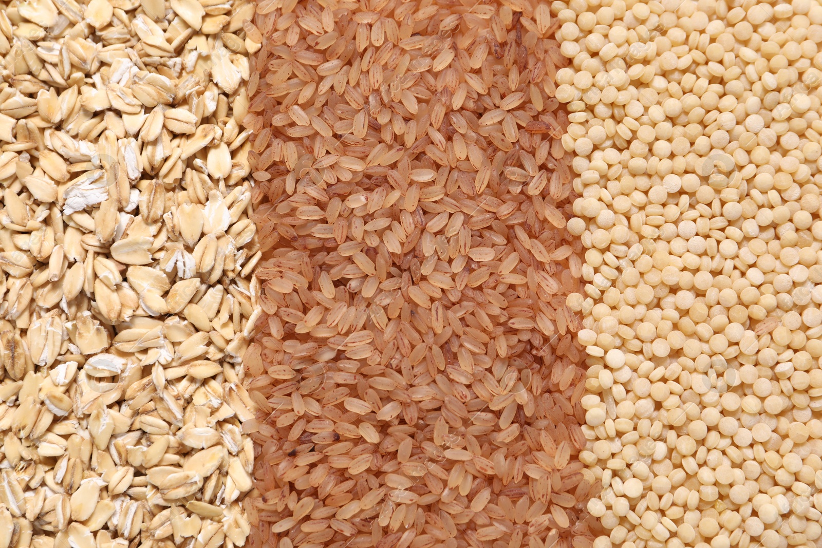 Photo of Different types of cereals as background, top view