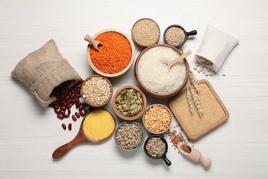 Photo of Different types of legumes, cereals and seeds on white wooden table, flat lay