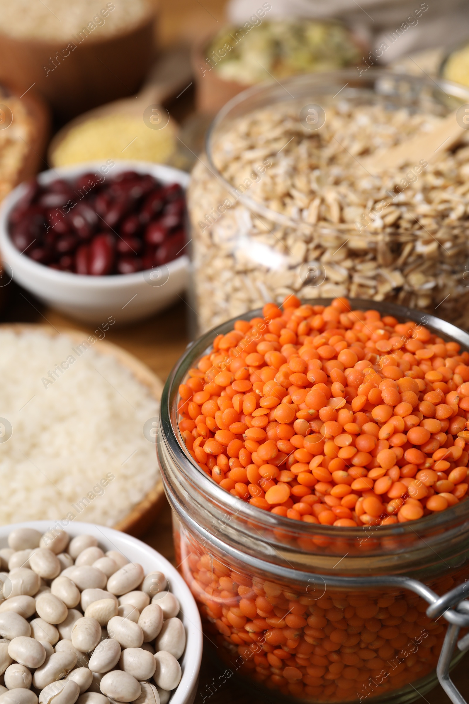 Photo of Different types of cereals and legumes on table, closeup