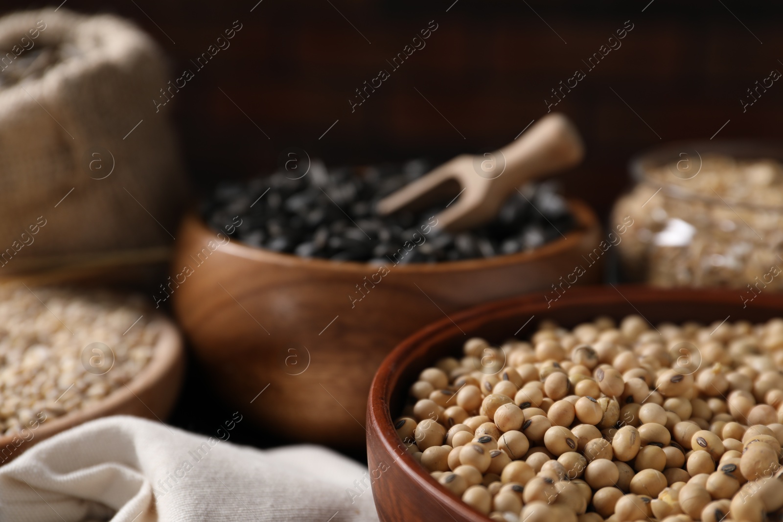 Photo of Different types of cereals and seeds on table, closeup