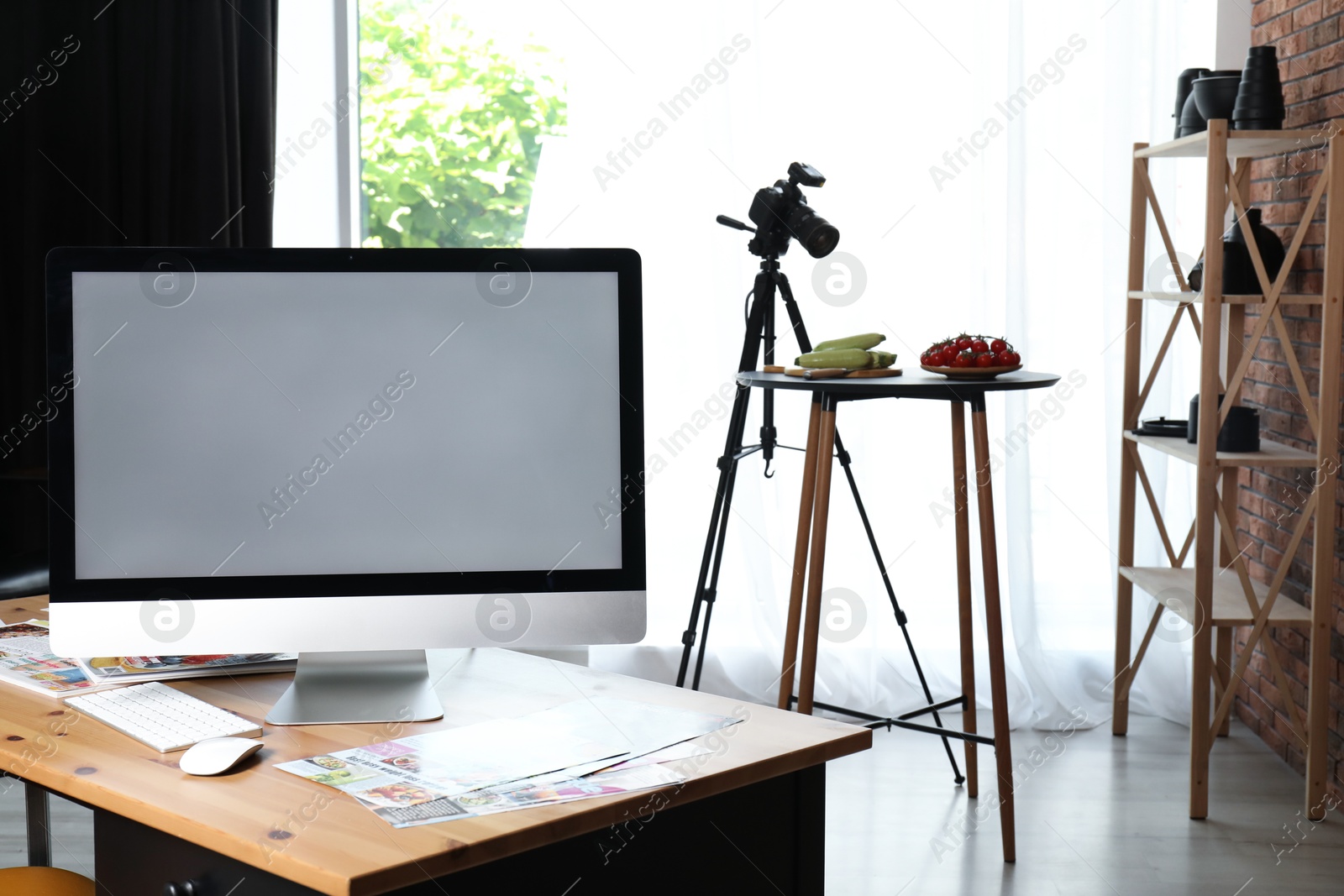 Photo of Shooting food in photo studio with professional equipment, focus on computer