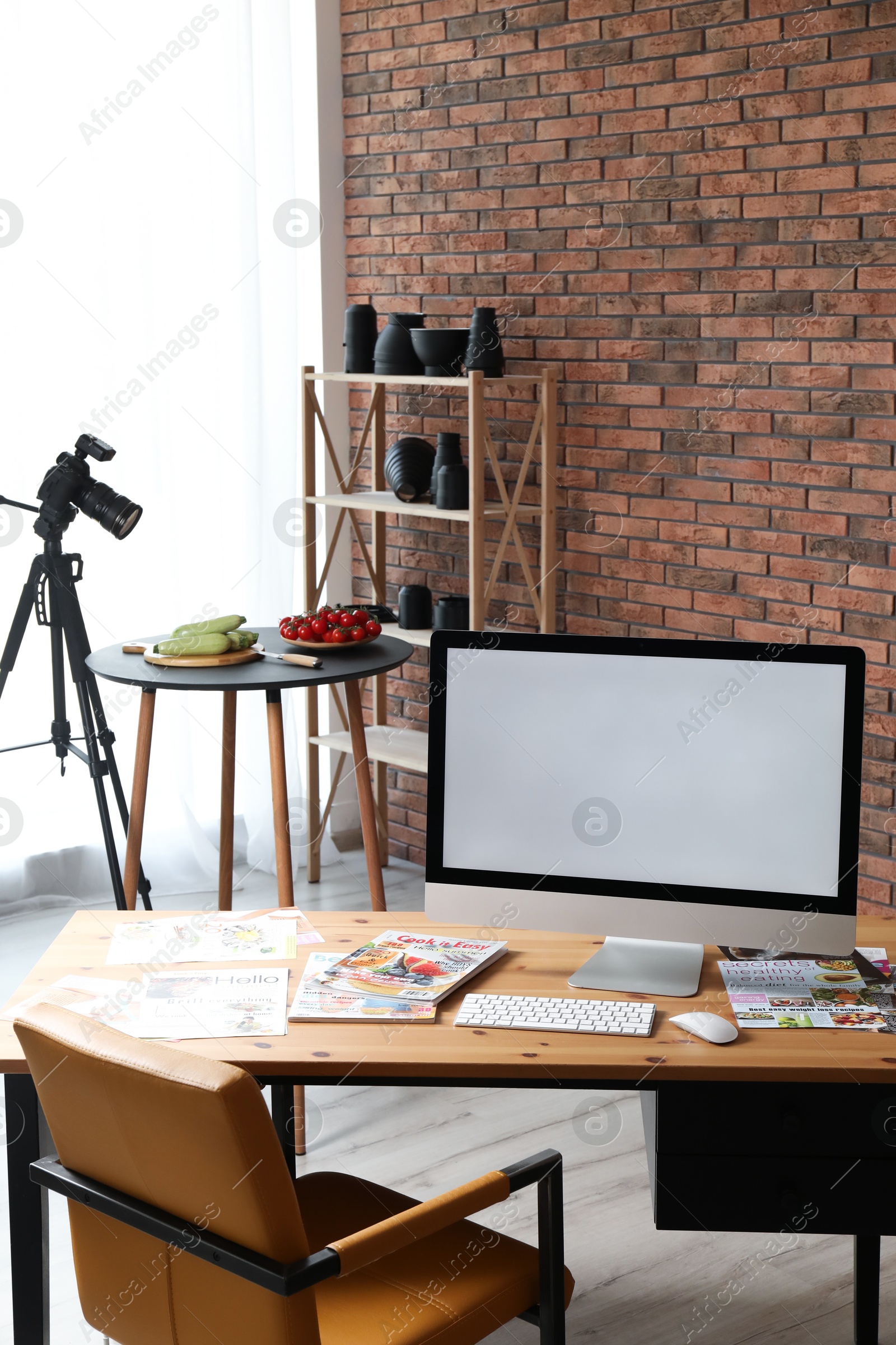 Photo of Shooting food in photo studio with professional equipment, focus on computer