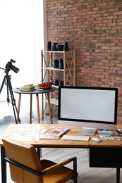 Photo of Shooting food in photo studio with professional equipment, focus on computer