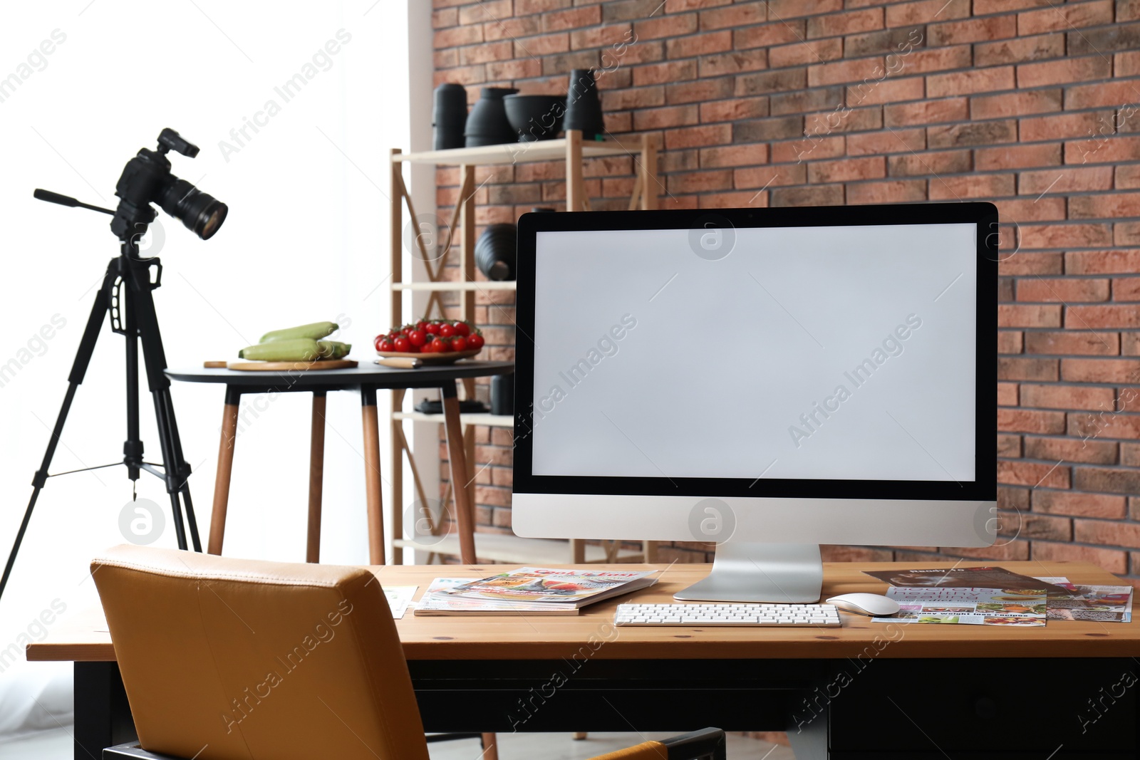 Photo of Shooting food in photo studio with professional equipment, focus on computer