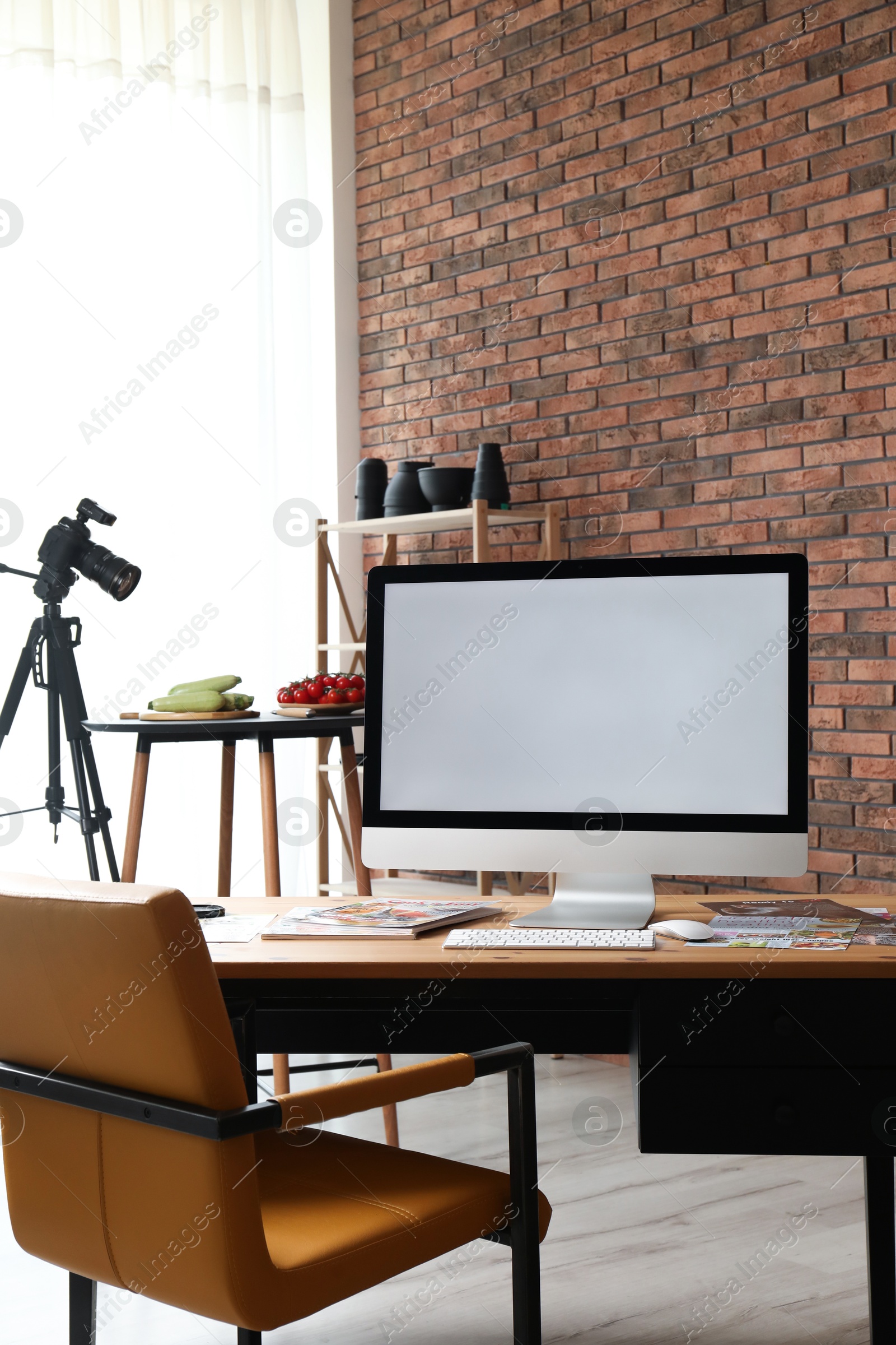 Photo of Shooting food in photo studio with professional equipment, focus on computer