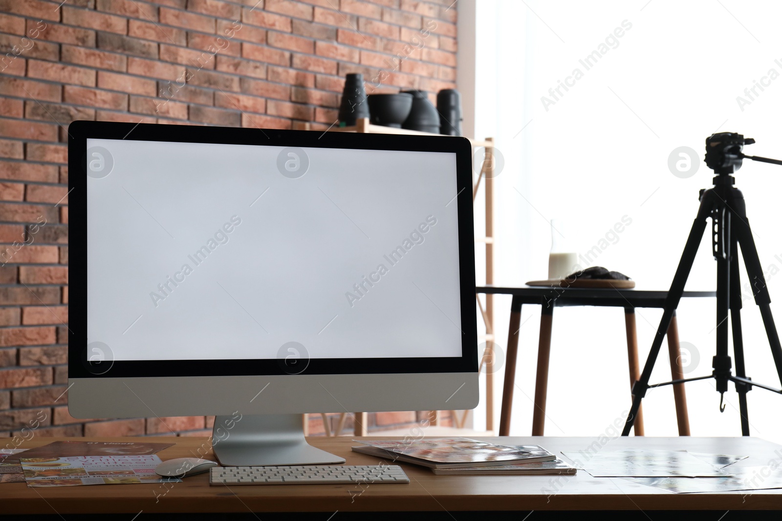 Photo of Shooting food in photo studio with professional equipment, focus on computer