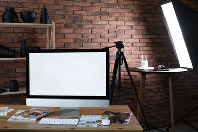 Photo of Shooting food in photo studio with professional equipment, focus on computer