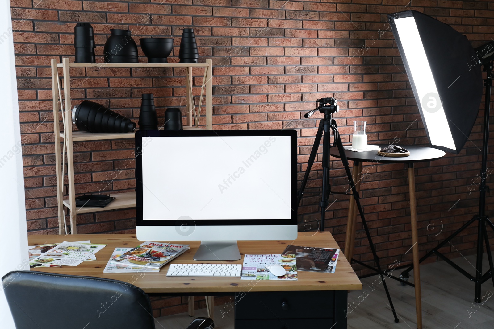 Photo of Shooting food in photo studio with professional equipment, focus on computer