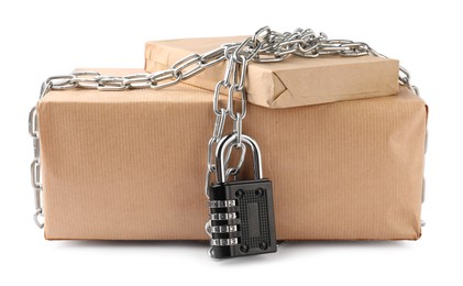 Photo of Parcels with chain and padlock isolated on white