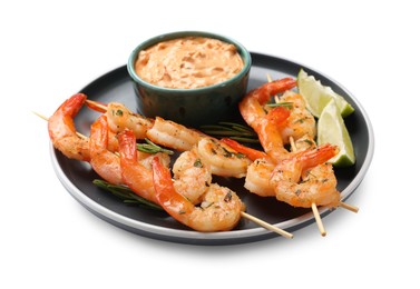 Photo of Skewers with delicious grilled shrimps, lime and sauce isolated on white