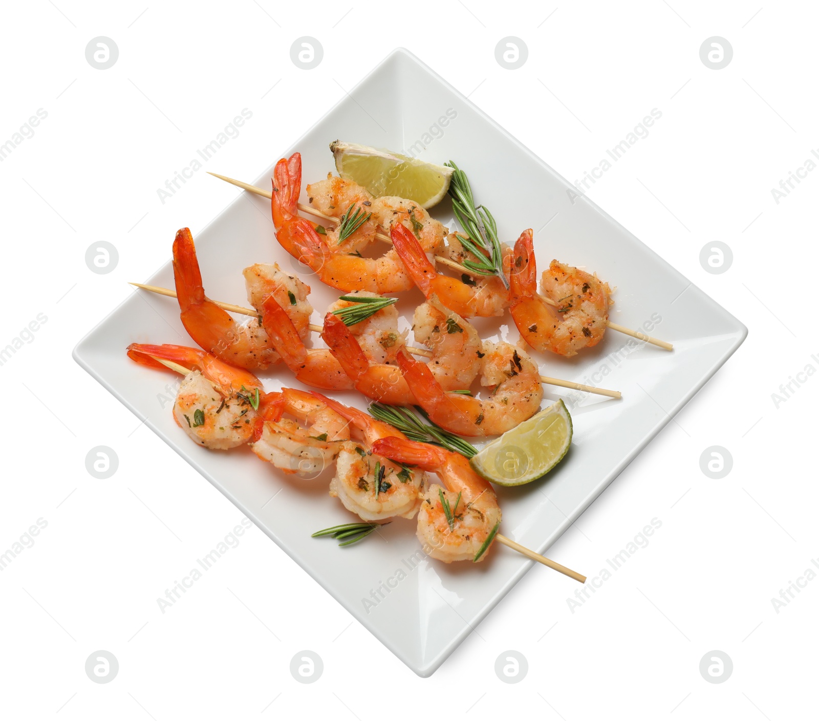 Photo of Skewers with delicious grilled shrimps and lime isolated on white, top view