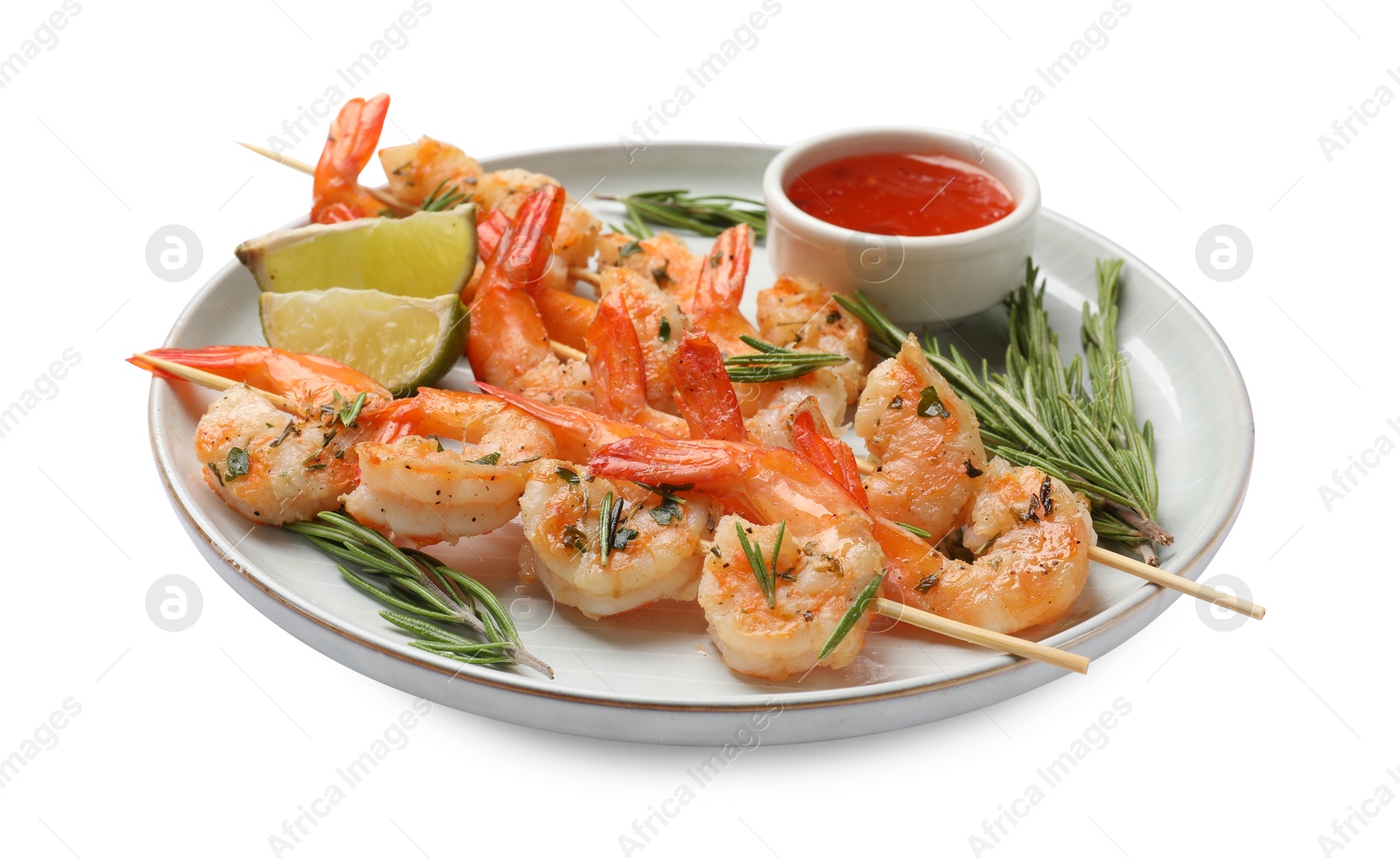 Photo of Skewers with delicious grilled shrimps, lime and sauce isolated on white