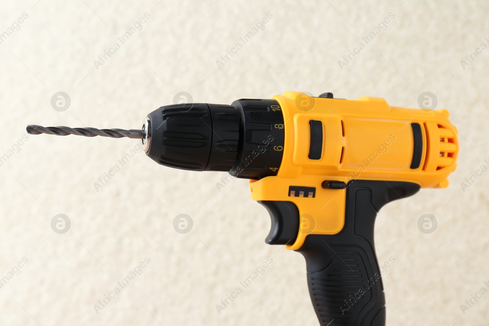 Photo of One cordless electric drill against blurred background