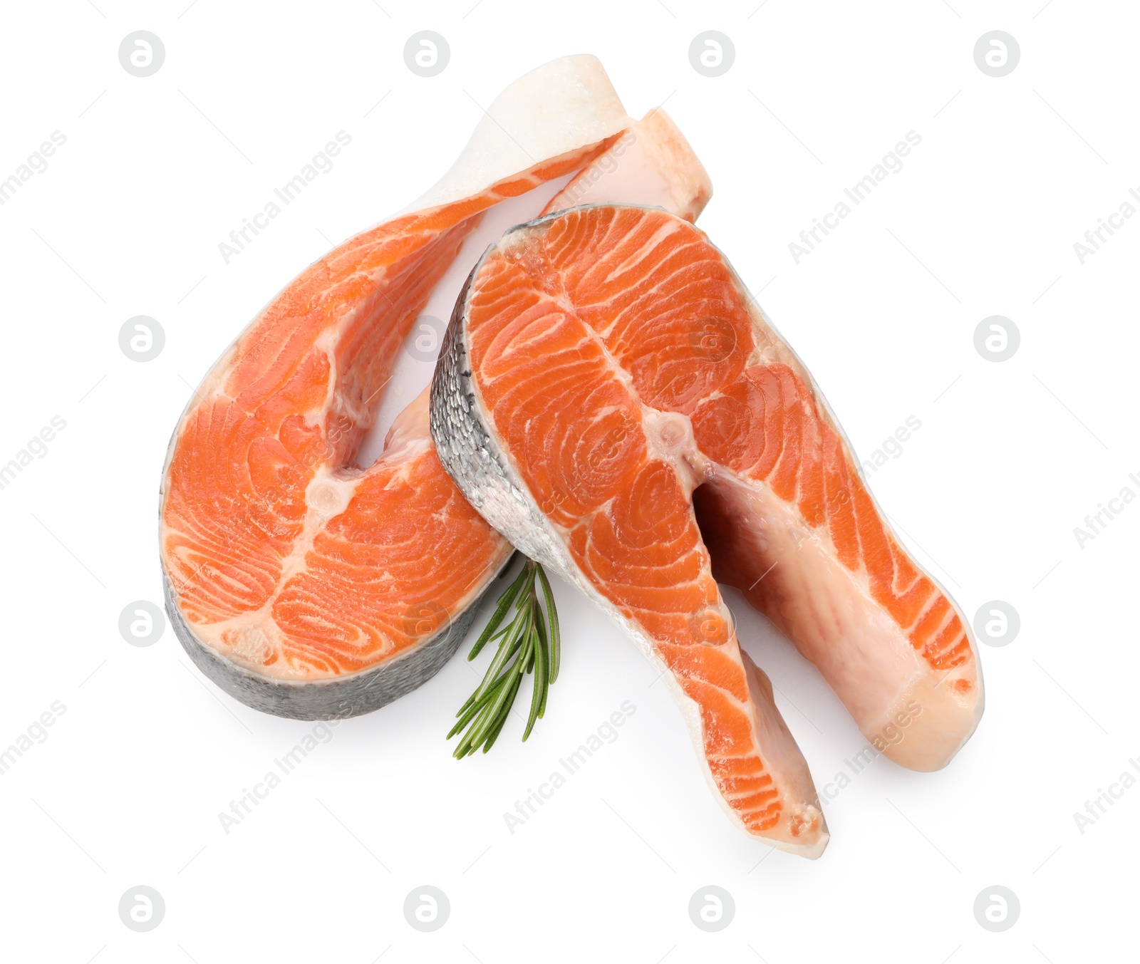 Photo of Two fresh salmon steaks and rosemary isolated on white, above view