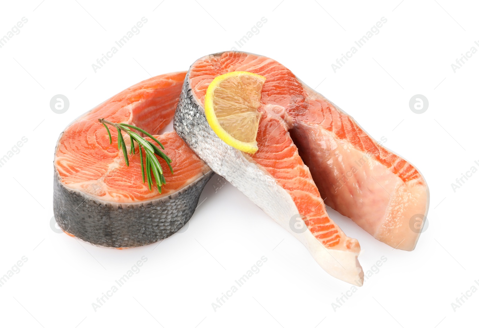 Photo of Two fresh salmon steaks, lemon and rosemary isolated on white