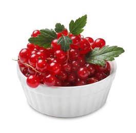 Photo of Ripe red currants with green leaves in bowl isolated on white