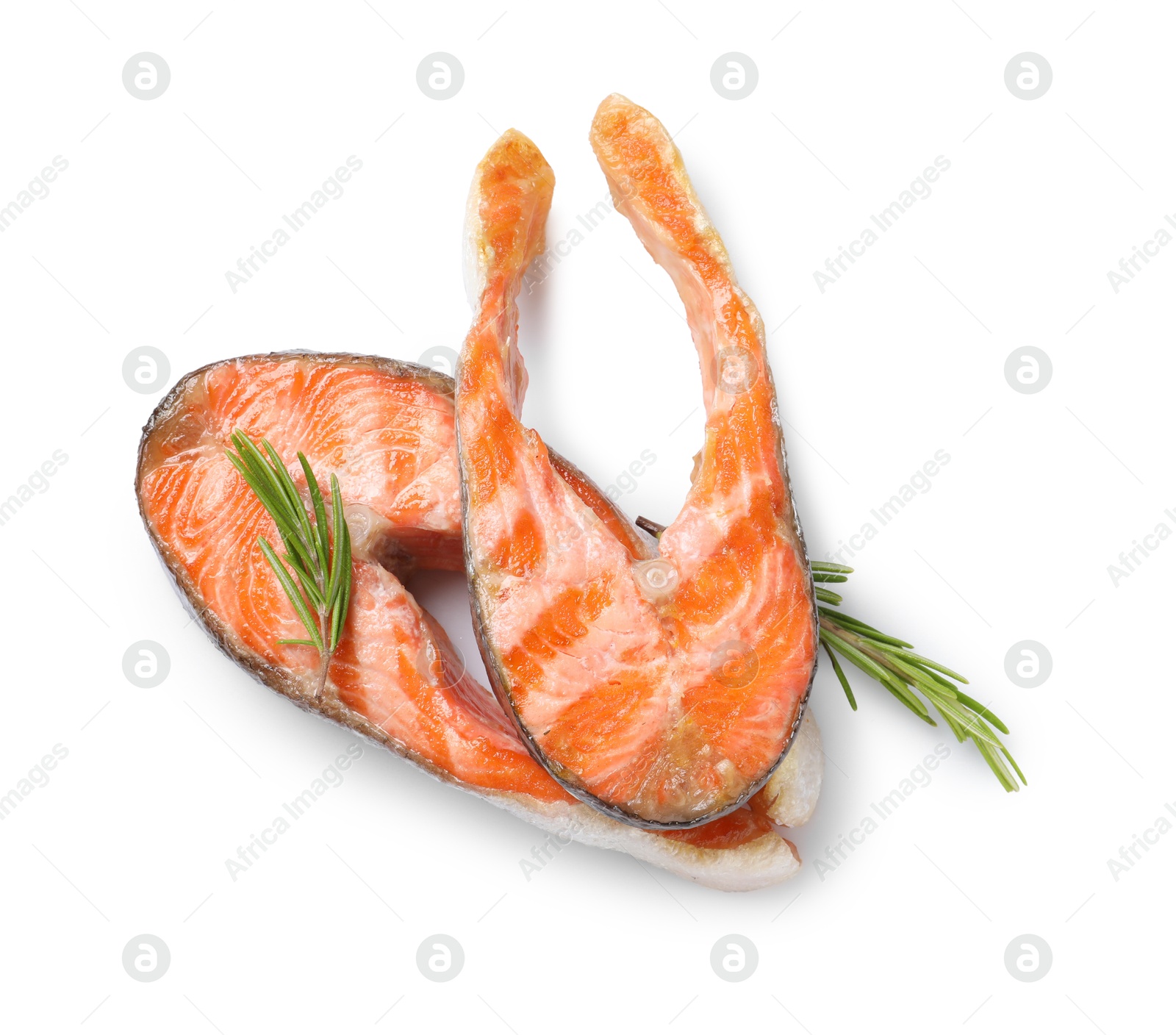 Photo of Tasty grilled salmon steaks and rosemary isolated on white, top view