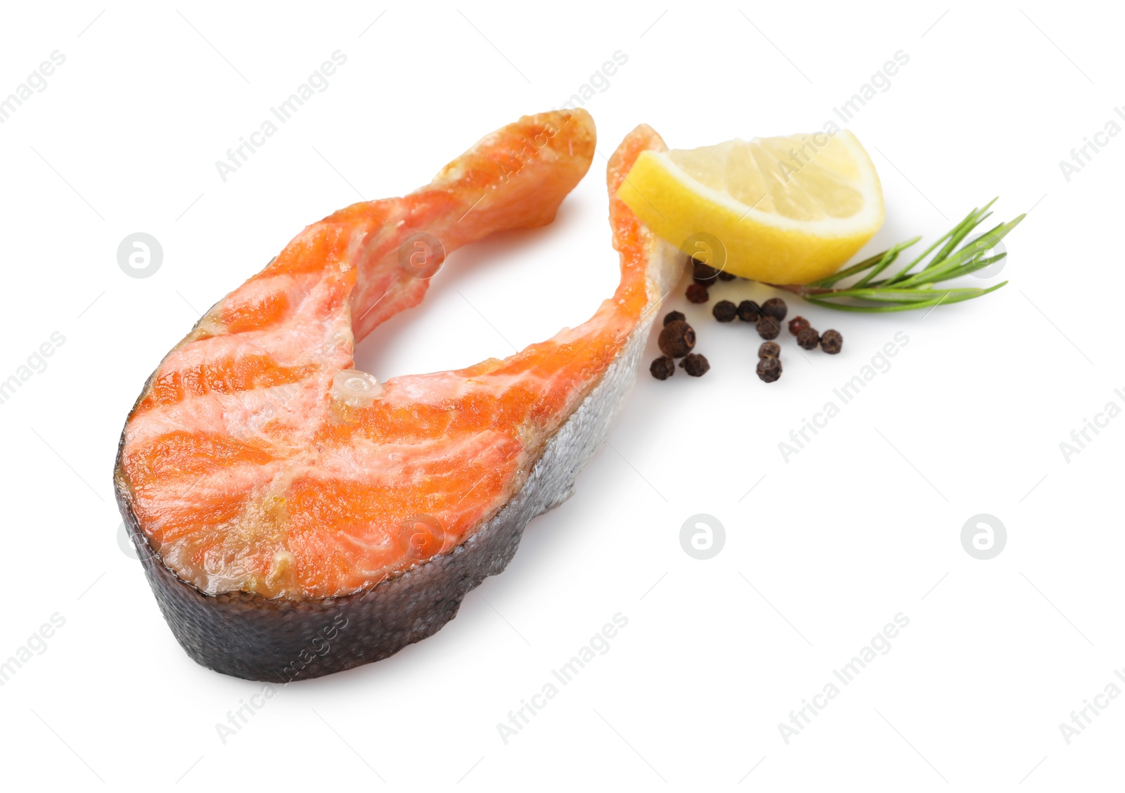 Photo of Tasty grilled salmon steak, lemon and spices isolated on white