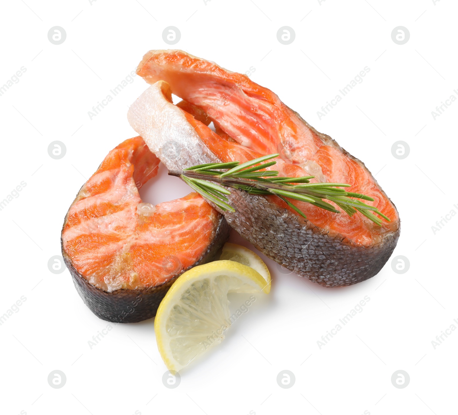 Photo of Tasty grilled salmon steaks and rosemary isolated on white