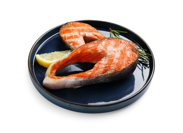 Photo of Tasty grilled salmon steaks, lemon and rosemary isolated on white