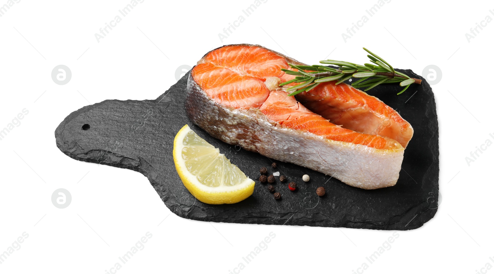 Photo of Tasty grilled salmon steak, lemon and spices isolated on white