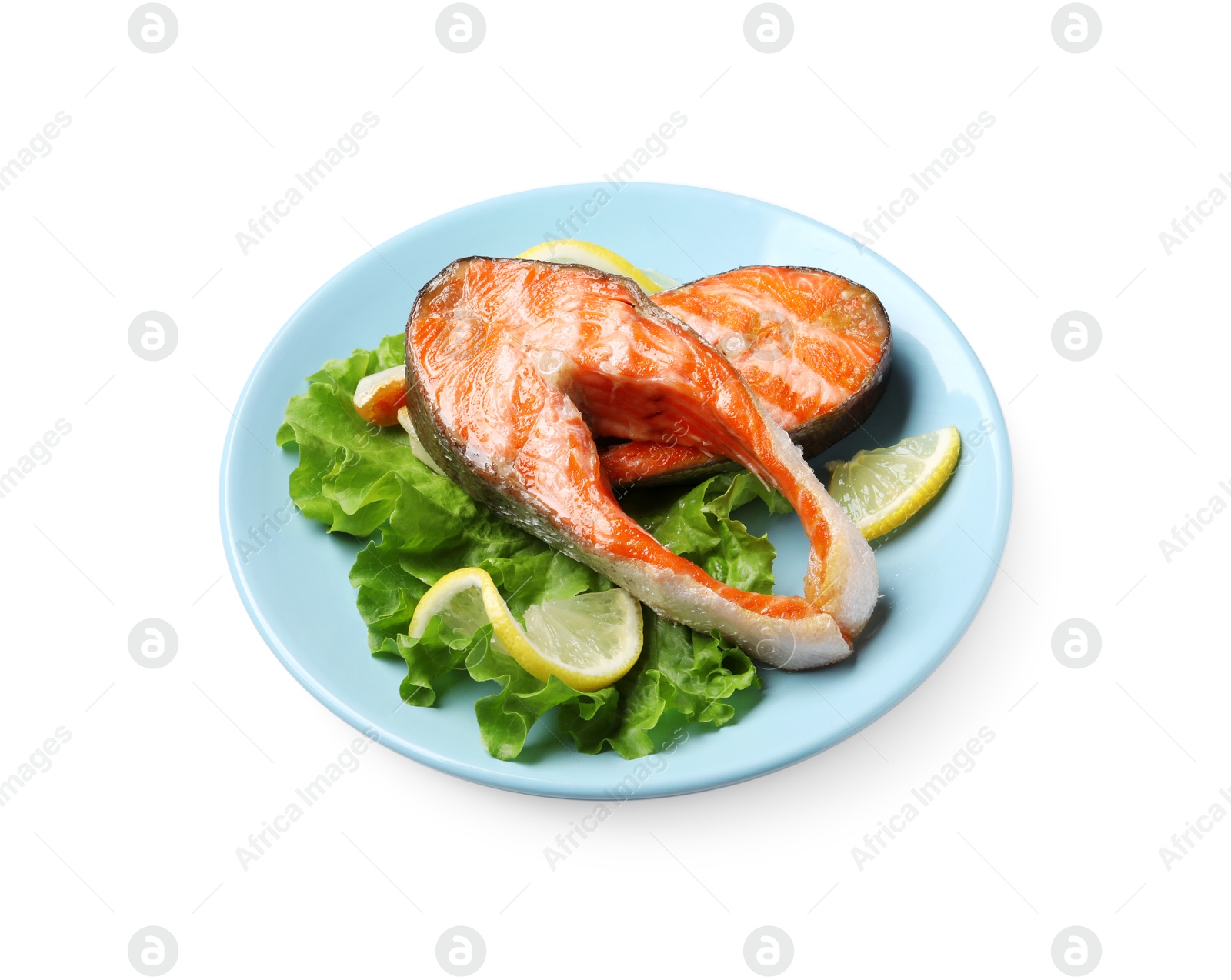 Photo of Tasty grilled salmon steaks, lettuce and lemon isolated on white