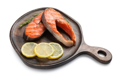 Photo of Tasty grilled salmon steaks, lemon and rosemary isolated on white