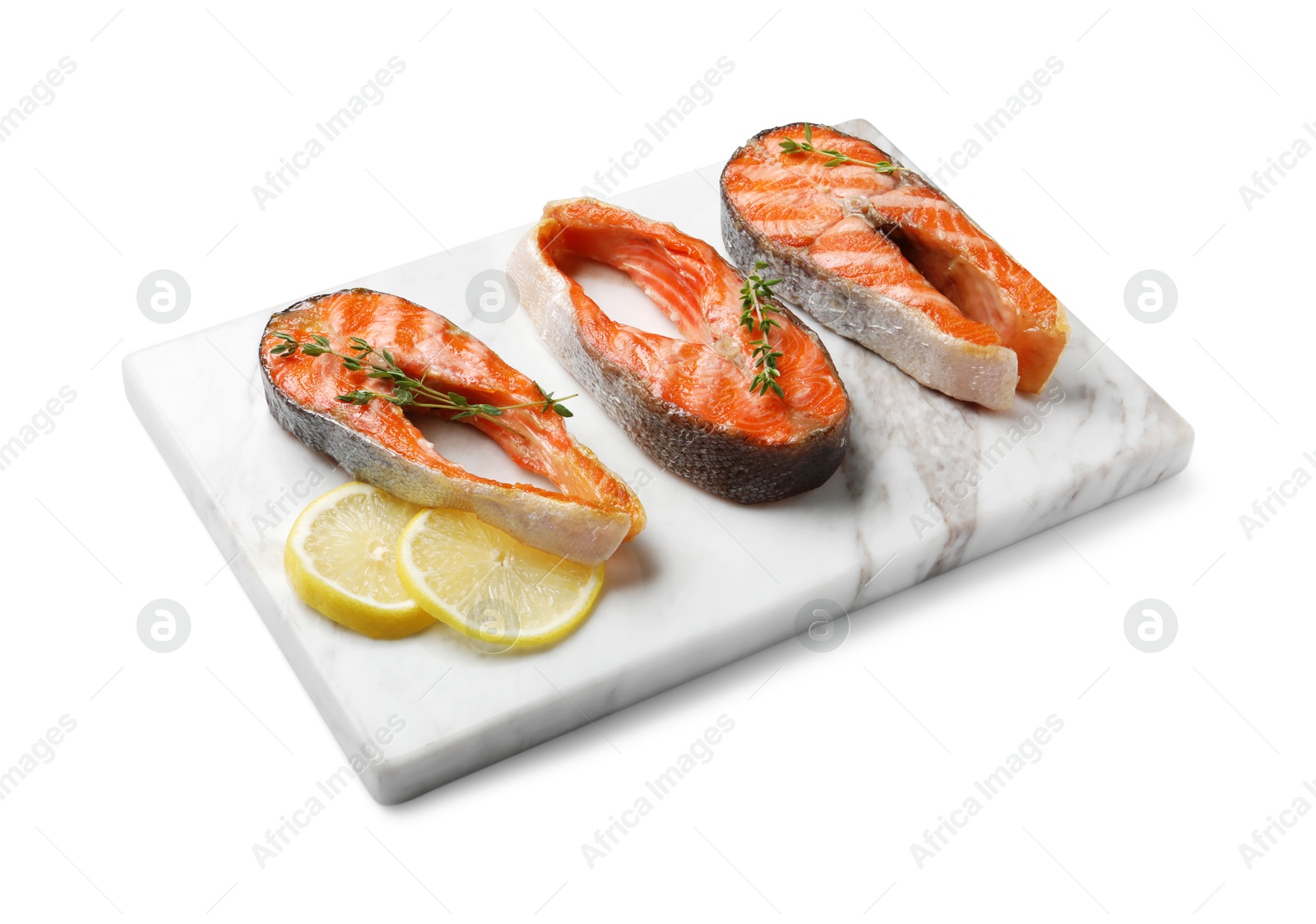 Photo of Tasty grilled salmon steaks, lemon and thyme isolated on white