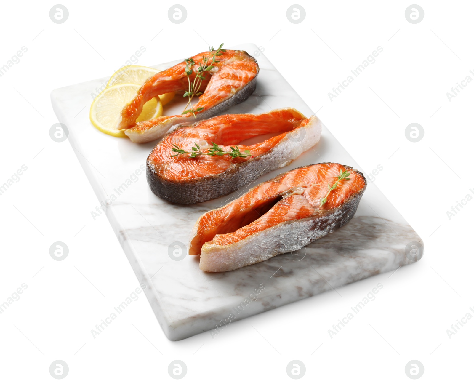 Photo of Tasty grilled salmon steaks, lemon and thyme isolated on white