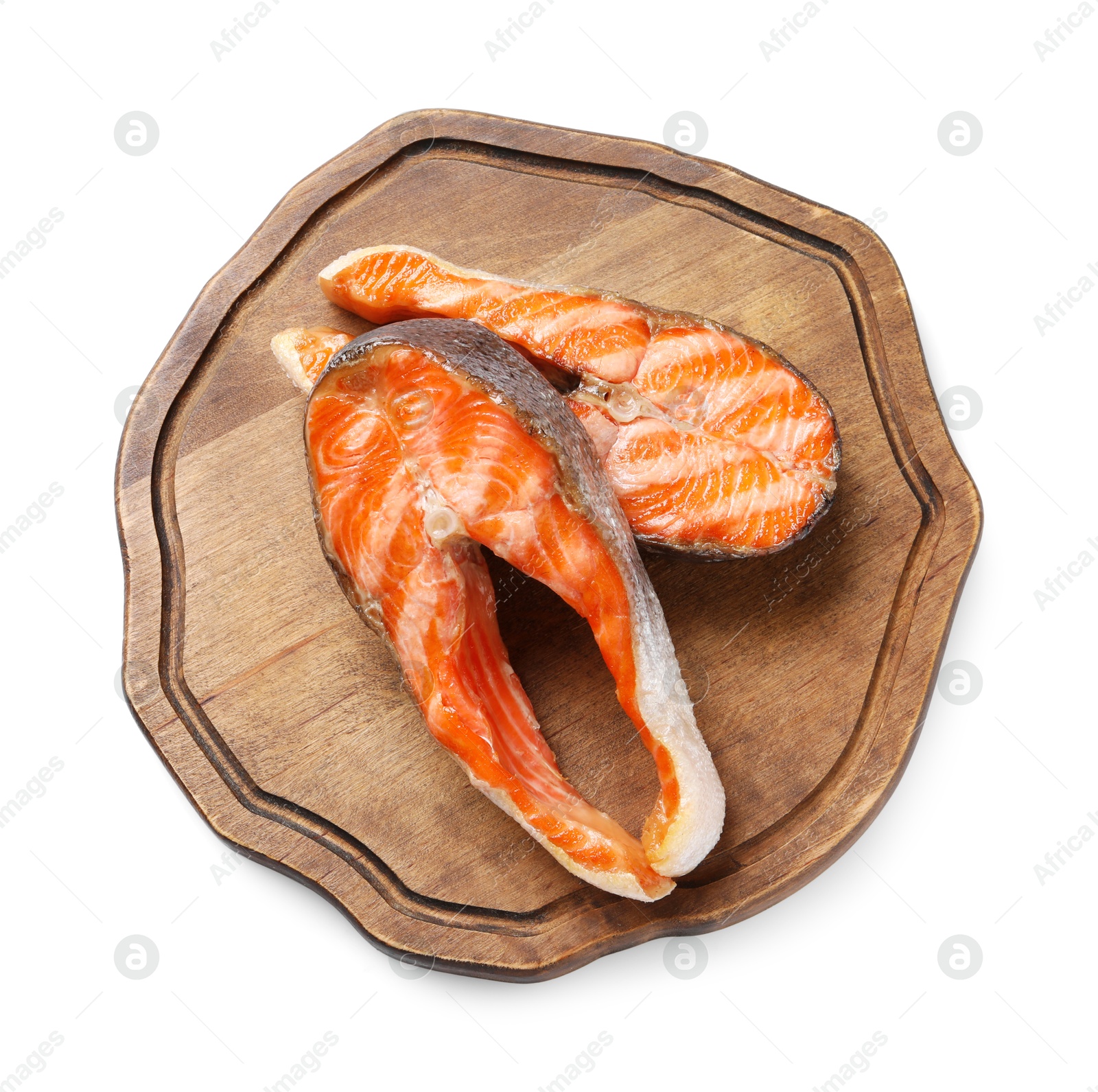 Photo of Tasty grilled salmon steaks isolated on white, top view