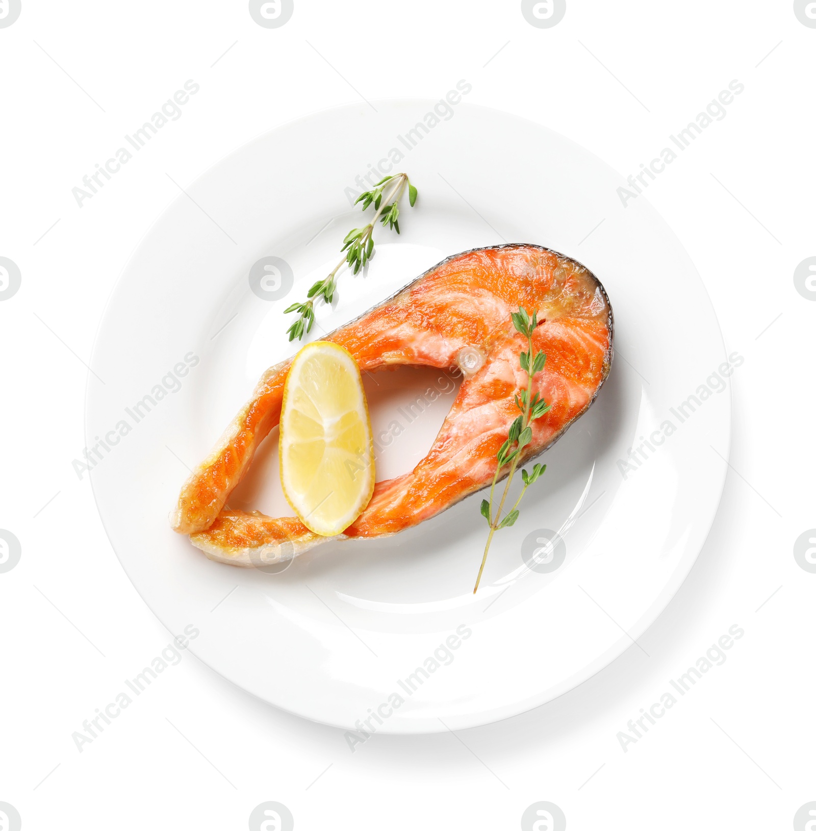 Photo of Tasty grilled salmon steak, lemon and thyme isolated on white, top view