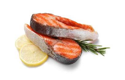 Photo of Tasty grilled salmon steaks, lemon and rosemary isolated on white