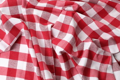 Photo of Crumpled checkered tablecloth as background, top view