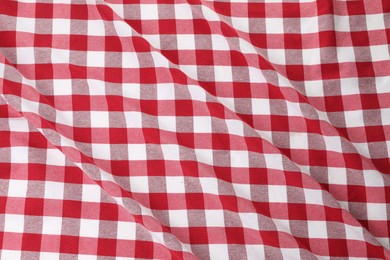 Photo of Crumpled checkered tablecloth as background, top view