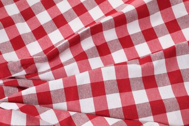 Photo of Crumpled checkered tablecloth as background, top view