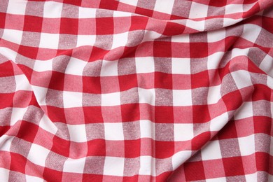 Photo of Crumpled checkered tablecloth as background, top view