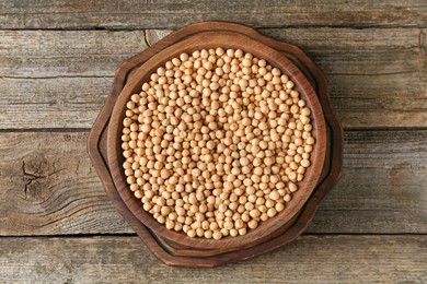 Dried peas on wooden table, top view