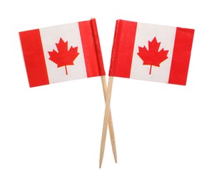 Small paper flags of Canada isolated on white