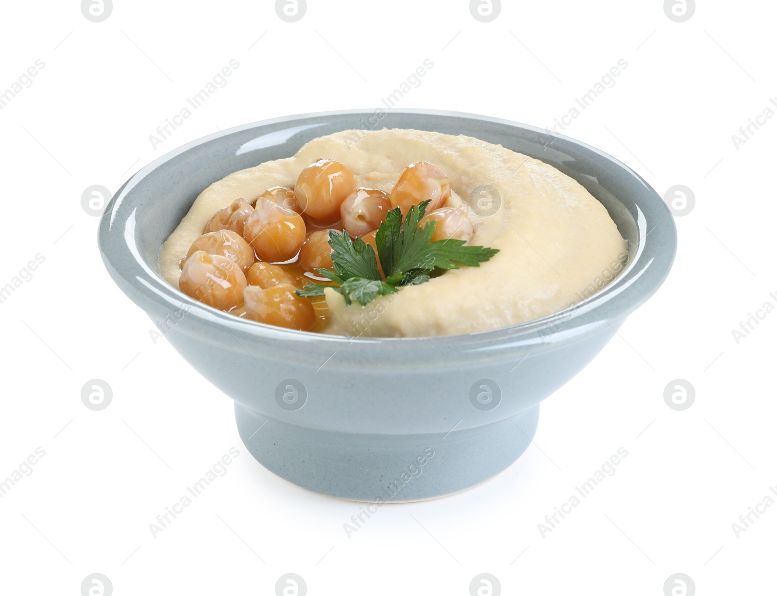 Photo of Delicious hummus with olive oil, chickpeas and parsley isolated on white