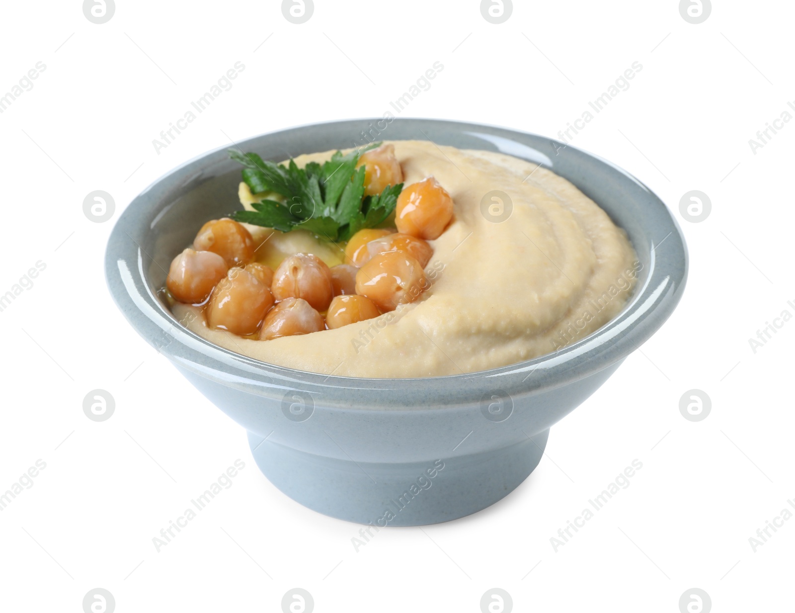 Photo of Delicious hummus with olive oil, chickpeas and parsley isolated on white