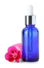 Photo of Geranium essential oil in bottle and beautiful flowers isolated on white