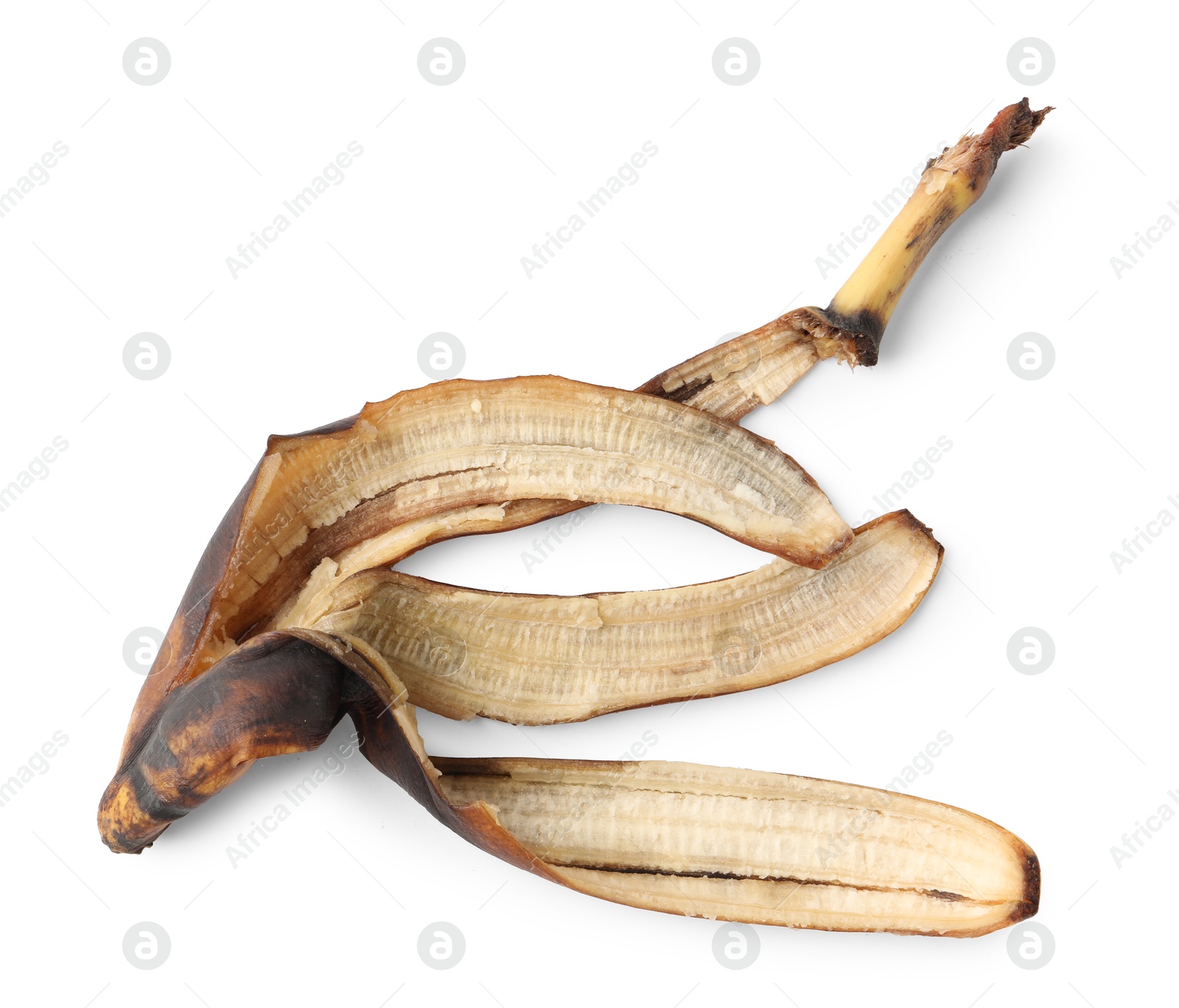 Photo of Banana peel with dark spots isolated on white, top view